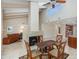 Open-concept living room featuring a fireplace, high ceilings, and seamless flow to the kitchen at 4317 E Glenrosa Ave, Phoenix, AZ 85018