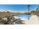Inviting pool area featuring lounge chairs, shade, and clear blue water for relaxing outdoor enjoyment at 4317 E Glenrosa Ave, Phoenix, AZ 85018
