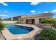 Private backyard featuring a pool with stone surround and patio area, perfect for outdoor entertaining at 43998 W Palo Abeto Dr, Maricopa, AZ 85138