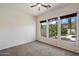Bedroom featuring three windows offering backyard views at 43998 W Palo Abeto Dr, Maricopa, AZ 85138