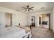 Bright bedroom with sliding door access to outdoor living space at 43998 W Palo Abeto Dr, Maricopa, AZ 85138