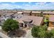 Charming single-Gathering home featuring a tile roof, mature trees, and a well-manicured front yard in a suburban neighborhood at 43998 W Palo Abeto Dr, Maricopa, AZ 85138