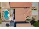 A detailed aerial of the backyard with pool, patios, and the terracotta roof of the house at 44158 W Cypress Ln, Maricopa, AZ 85138