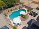 Aerial view of a backyard featuring a kidney-shaped pool, hot tub, and lounge area at 44158 W Cypress Ln, Maricopa, AZ 85138