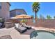 Lounge chairs near the pool and spa with the covered hot tub nearby at 44158 W Cypress Ln, Maricopa, AZ 85138