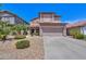 Two-story home with desert landscaping, tile roof and a large two car garage in a sunny, upscale neighborhood at 44158 W Cypress Ln, Maricopa, AZ 85138