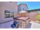 Backyard hot tub with adjacent patio, perfect for relaxation and entertaining at 44158 W Cypress Ln, Maricopa, AZ 85138