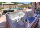Close-up of a backyard hot tub featuring multiple jets and seating at 44158 W Cypress Ln, Maricopa, AZ 85138