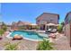 Sparkling pool surrounded by lush landscaping, offering a serene and private outdoor experience at 44158 W Cypress Ln, Maricopa, AZ 85138