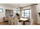 Bright dining room with modern lighting, large windows, and neutral color palette at 5941 E Lafayette Blvd, Phoenix, AZ 85018