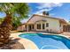 A beautiful backyard showcasing a pool, patio, and lush landscaping at 626 W Catclaw St, Gilbert, AZ 85233