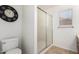 Bathroom with a glass-enclosed shower and neutral tile flooring at 626 W Catclaw St, Gilbert, AZ 85233