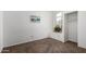 Bedroom with carpet flooring, natural light from a window, and a convenient closet at 626 W Catclaw St, Gilbert, AZ 85233