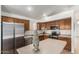 Well-lit kitchen featuring stainless steel appliances and ample counter space at 626 W Catclaw St, Gilbert, AZ 85233