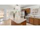 Well-equipped kitchen featuring an island, stainless steel appliances, and a bright dining area at 626 W Catclaw St, Gilbert, AZ 85233