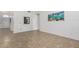 Bright living room featuring neutral tile flooring and plenty of natural light from large windows at 626 W Catclaw St, Gilbert, AZ 85233