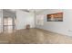 Bright living room featuring neutral tile flooring and plenty of natural light from large windows at 626 W Catclaw St, Gilbert, AZ 85233