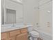 Bathroom with a tub and a single sink vanity with neutral colors at 708 E Mule Train Trl, San Tan Valley, AZ 85143