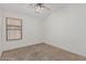 Bedroom featuring a ceiling fan and a window with blinds at 708 E Mule Train Trl, San Tan Valley, AZ 85143