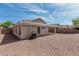 Beige single story home with desert landscaping and blue sky at 708 E Mule Train Trl, San Tan Valley, AZ 85143
