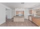 Well-lit kitchen with island, tile floor and modern appliances at 708 E Mule Train Trl, San Tan Valley, AZ 85143
