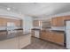 Updated kitchen features an island, modern appliances, and plenty of cabinet space at 708 E Mule Train Trl, San Tan Valley, AZ 85143