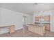 Open kitchen with tile flooring, central island, and modern fixtures at 708 E Mule Train Trl, San Tan Valley, AZ 85143