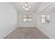 Well-lit living area featuring plush carpeting, and a chandelier at 708 E Mule Train Trl, San Tan Valley, AZ 85143
