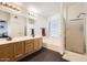 Bathroom features dual sinks, vanity, walk-in shower and garden tub offering a spa-like experience at 7239 E Madero Ave, Mesa, AZ 85209