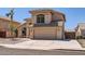 Attractive exterior of home with two-car garage, showcasing desert landscaping and tiled roof at 7239 E Madero Ave, Mesa, AZ 85209