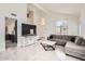 Bright, open-concept living room with marble floors, high ceilings, and plenty of natural light at 7239 E Madero Ave, Mesa, AZ 85209