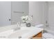 Bright bathroom features single sink vanity, white countertop, and shower over tub at 7318 W St Charles Ave, Laveen, AZ 85339