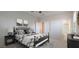 Comfortable bedroom featuring neutral paint and carpet with ensuite bathroom at 7318 W St Charles Ave, Laveen, AZ 85339