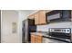 Well-equipped kitchen features stainless steel appliances and neutral countertops at 7318 W St Charles Ave, Laveen, AZ 85339
