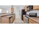 Functional kitchen with stainless appliances, ample cabinet storage, and easy access to the dining area at 7318 W St Charles Ave, Laveen, AZ 85339
