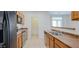 Efficient kitchen layout with stainless steel appliances and tile flooring at 7318 W St Charles Ave, Laveen, AZ 85339