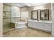 A luxurious bathroom features a walk-in shower, soaking tub, and dual vanities at 7340 W Bronco Trl, Peoria, AZ 85383
