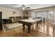 Game room featuring a pool table, sectional sofa, and a dinette area at 7340 W Bronco Trl, Peoria, AZ 85383