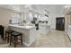 A bright kitchen features white cabinets, granite countertops, and stainless steel appliances at 7340 W Bronco Trl, Peoria, AZ 85383