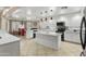 A bright kitchen features white cabinets, granite countertops, and stainless steel appliances at 7340 W Bronco Trl, Peoria, AZ 85383