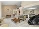 Spacious living room with seating arrangements and an open view to the dining area at 7340 W Bronco Trl, Peoria, AZ 85383