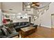 Spacious living room features a large sectional couch with a view of the kitchen at 7340 W Bronco Trl, Peoria, AZ 85383