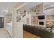 Multi-level house showcases the living room, kitchen, staircase and fireplace at 7340 W Bronco Trl, Peoria, AZ 85383