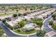 Wide aerial view of the community with well-maintained landscaping, community pool, and lush scenery at 7955 E Chaparral Rd # 141, Scottsdale, AZ 85250