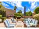 Inviting backyard with outdoor seating, built-in grill, and lush greenery at 7955 E Chaparral Rd # 141, Scottsdale, AZ 85250