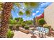 Beautiful backyard with comfortable seating, vibrant foliage, and a relaxing atmosphere at 7955 E Chaparral Rd # 141, Scottsdale, AZ 85250