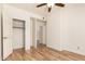 Bedroom featuring hardwood floors and access to closet and bathroom at 7955 E Chaparral Rd # 141, Scottsdale, AZ 85250
