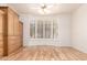 Spacious bedroom features hardwood floors, large bay window, and custom built-in cabinetry at 7955 E Chaparral Rd # 141, Scottsdale, AZ 85250