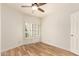 Light and bright bedroom features hardwood floors and plantation shutters at 7955 E Chaparral Rd # 141, Scottsdale, AZ 85250