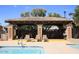 Poolside cabana features shaded seating area for residents to enjoy the pool and Arizona sunshine at 7955 E Chaparral Rd # 141, Scottsdale, AZ 85250